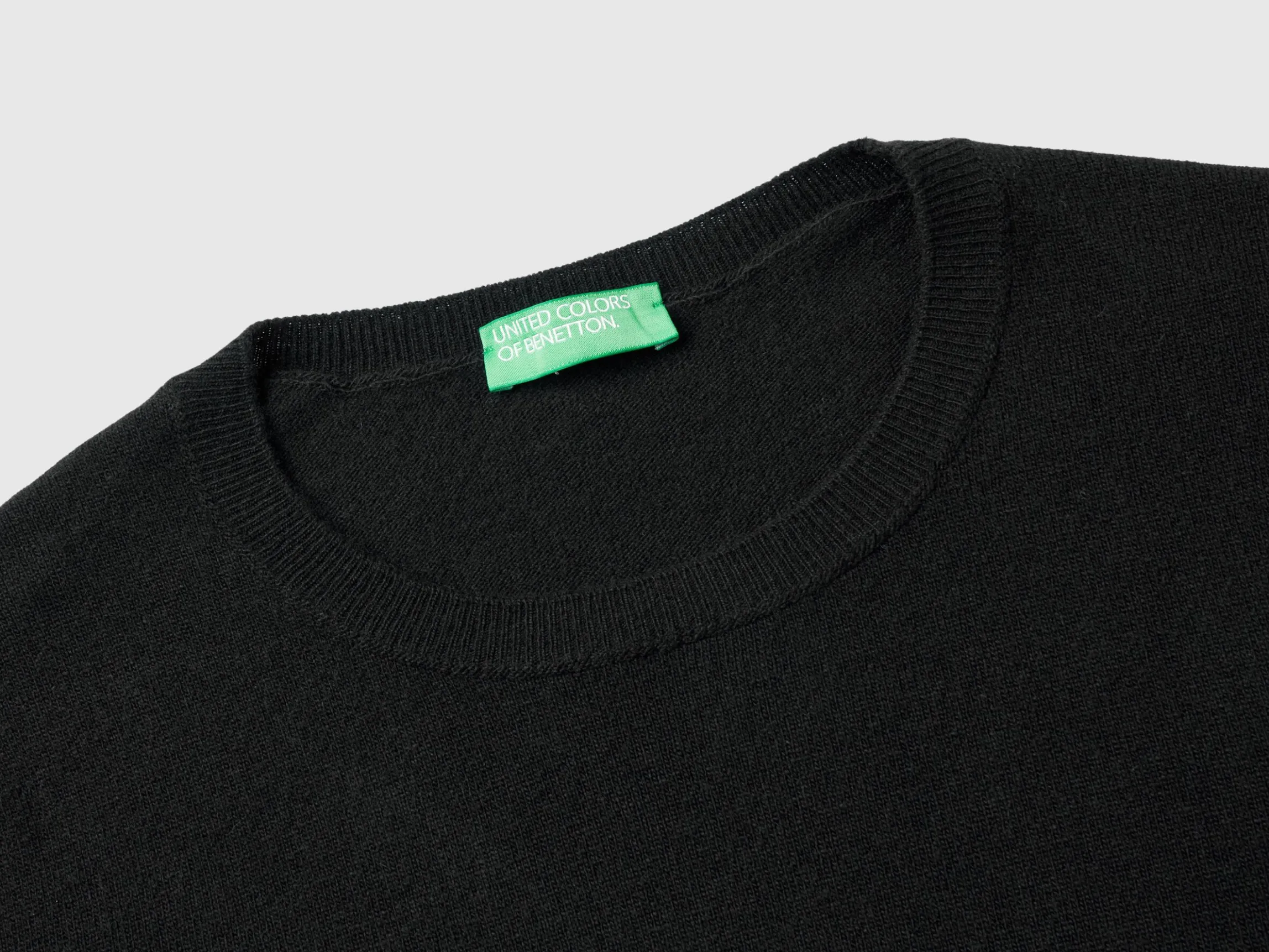 Black short sleeve sweater in pure Merino wool