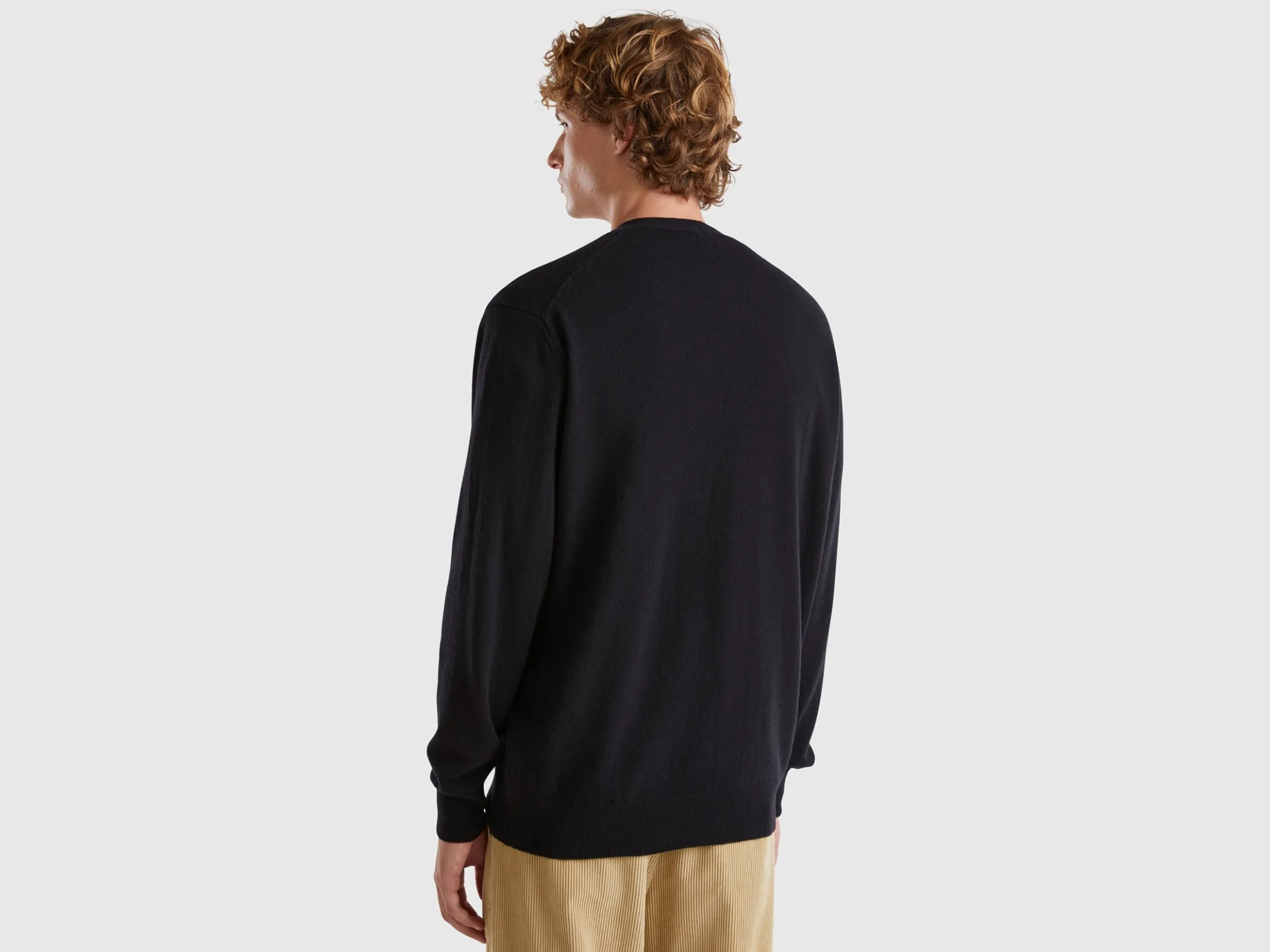 Black V-neck cardigan in pure Merino wool