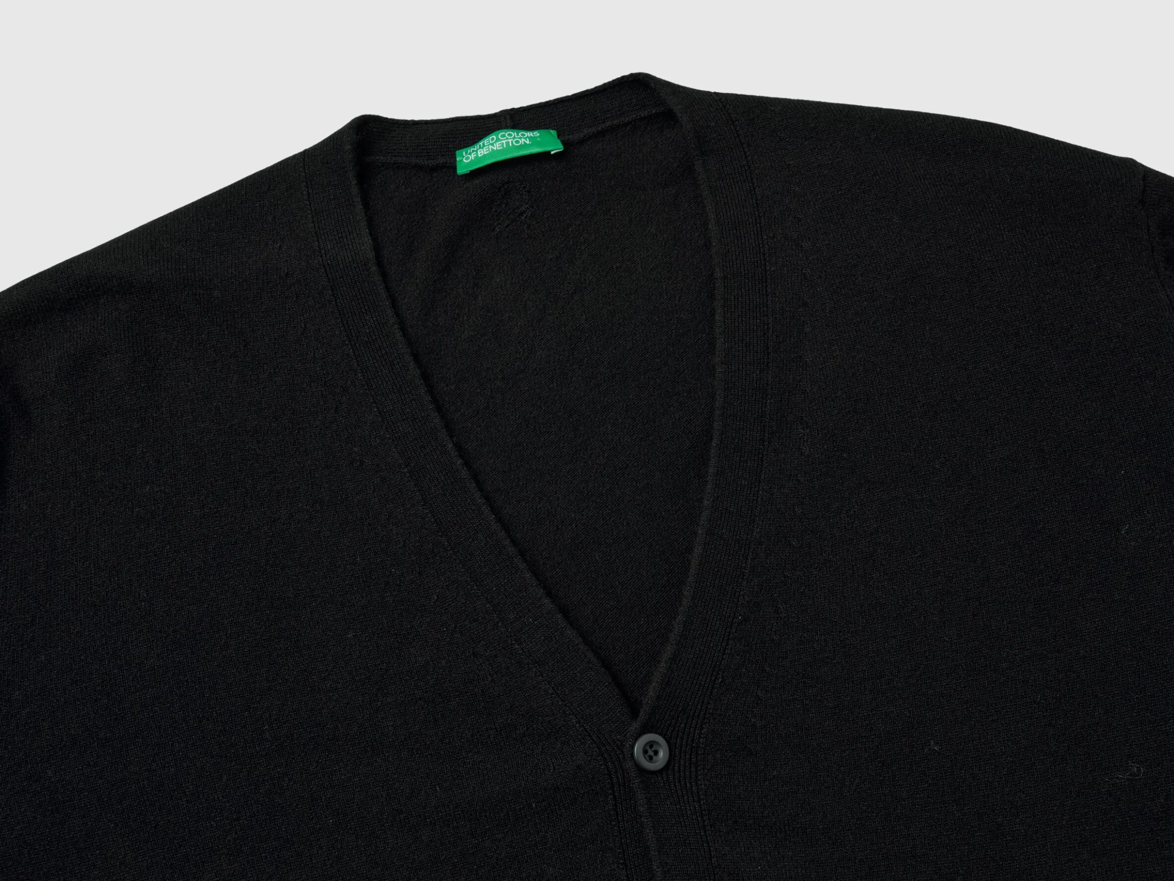 Black V-neck cardigan in pure Merino wool