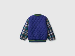 Bomber jacket with tartan sleeves