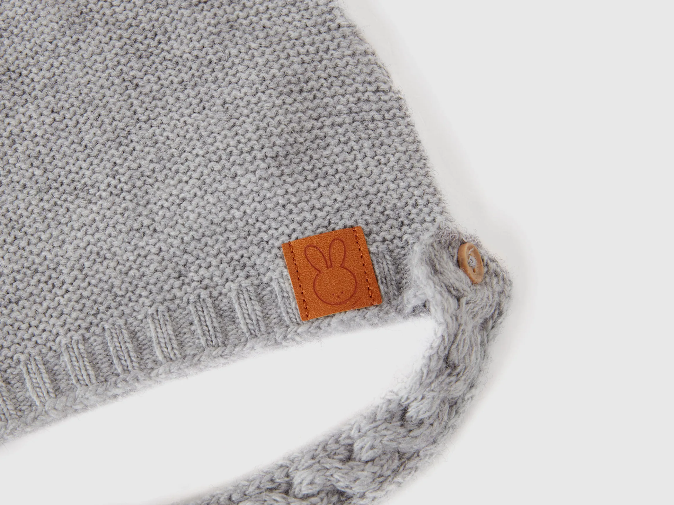 Cap with ear applique in recycled wool blend