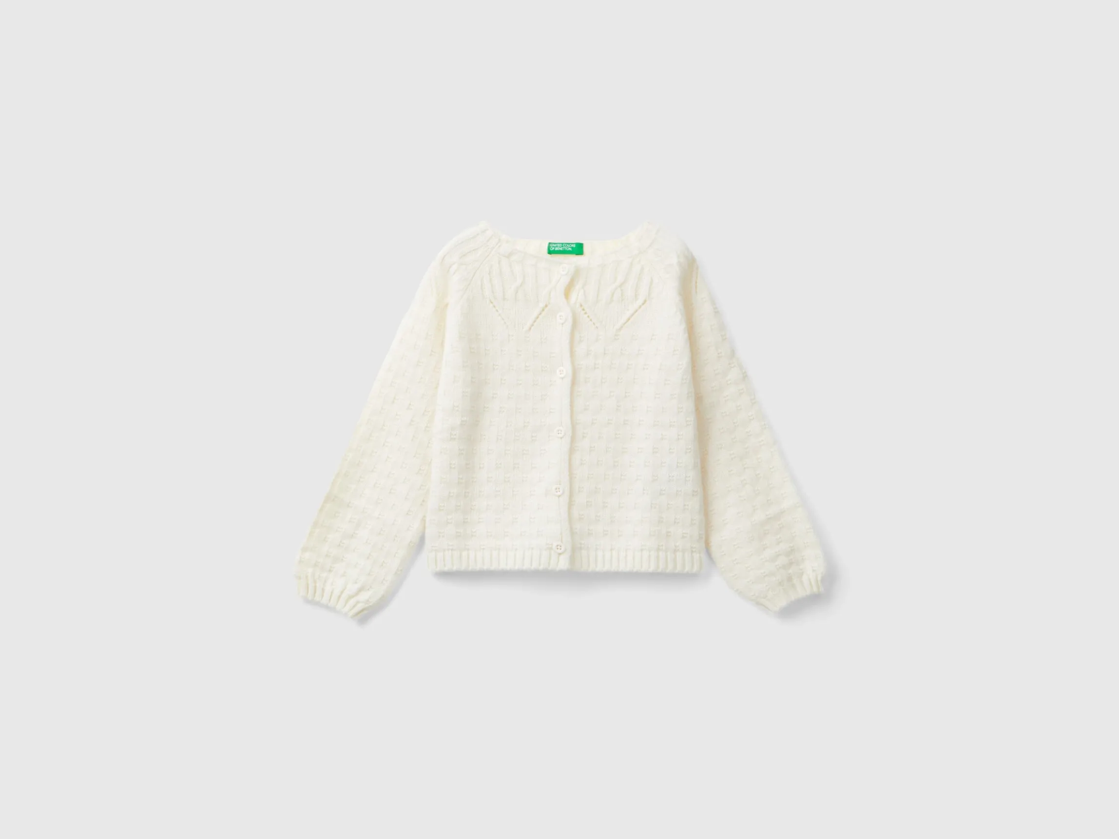 Cardigan with perforated details