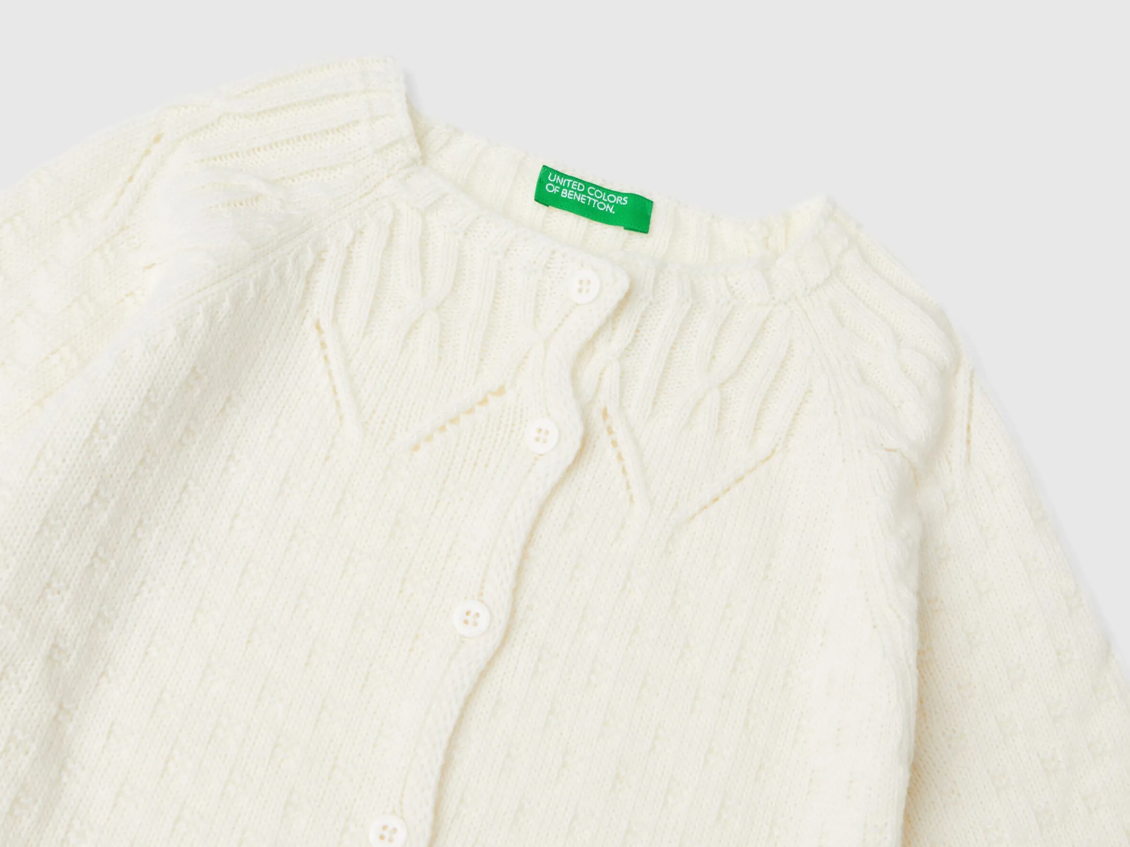 Cardigan with perforated details