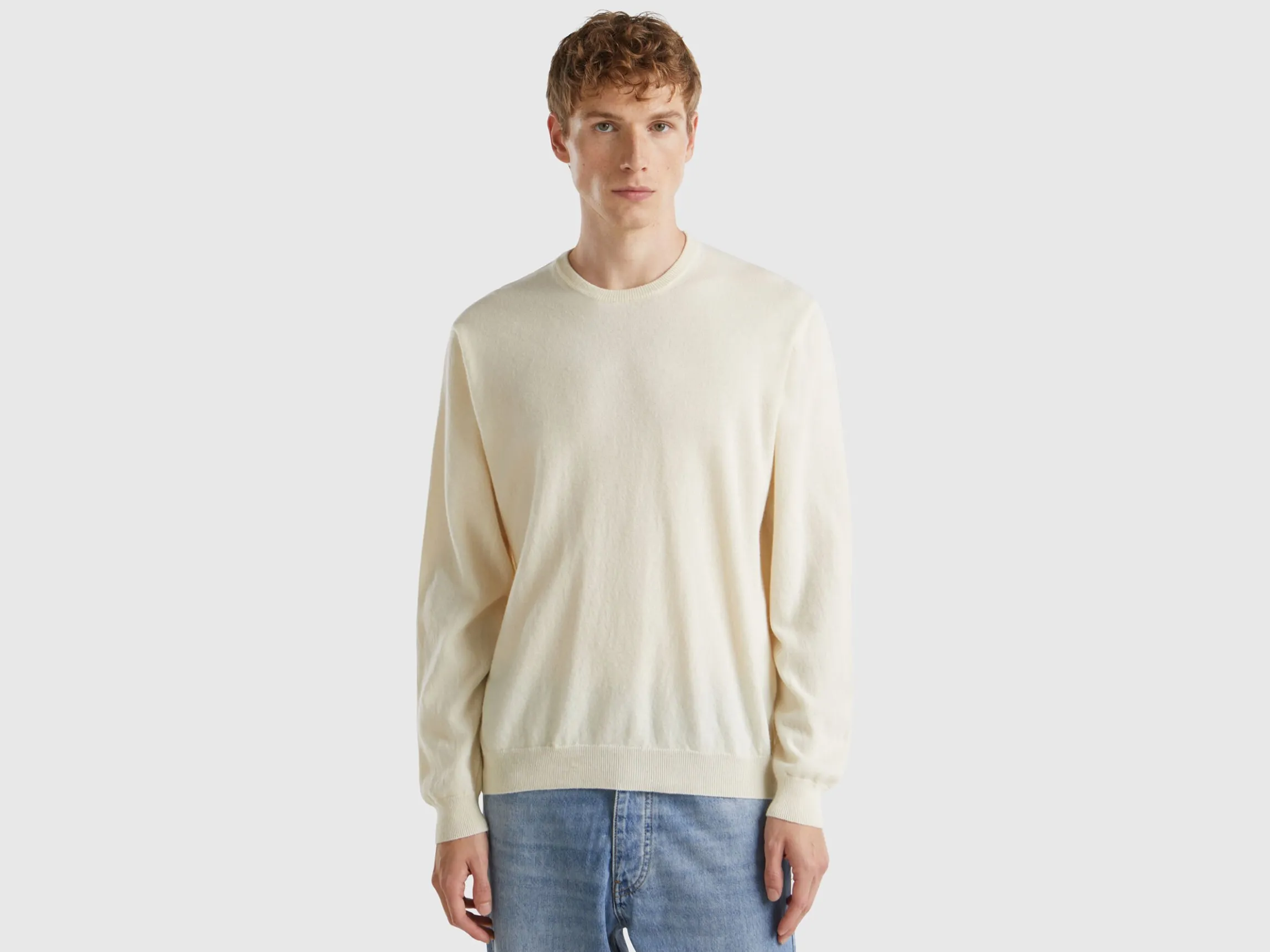 Creamy white crew neck sweater in pure Merino wool