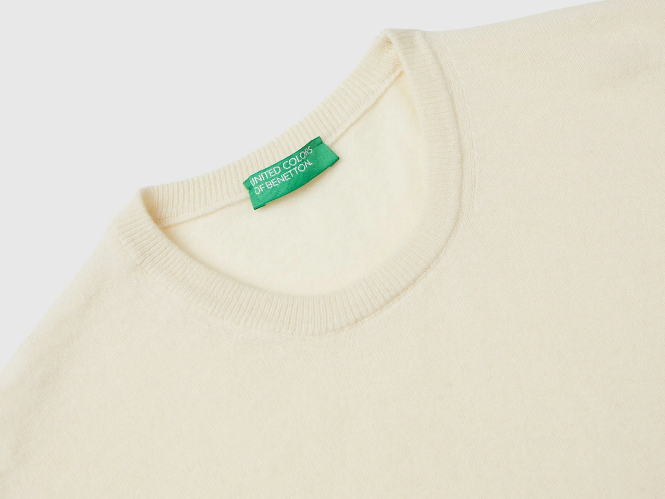 Creamy white crew neck sweater in pure Merino wool