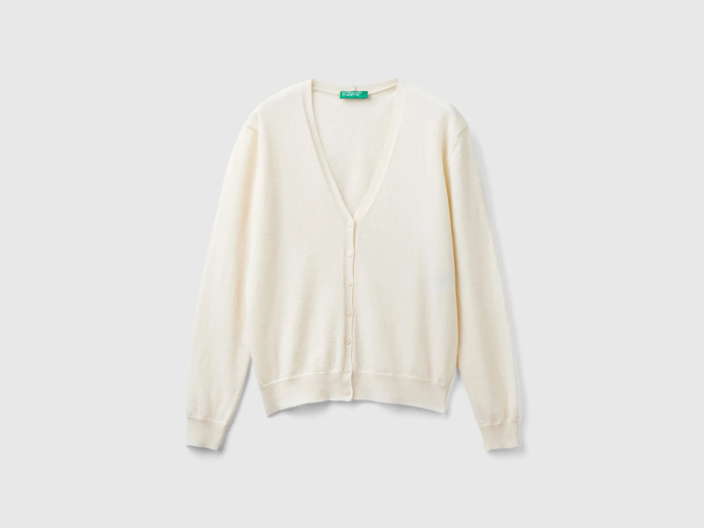 Creamy white V- neck cardigan in pure Merino wool