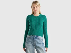 Cropped sweater with cable knit and perforations