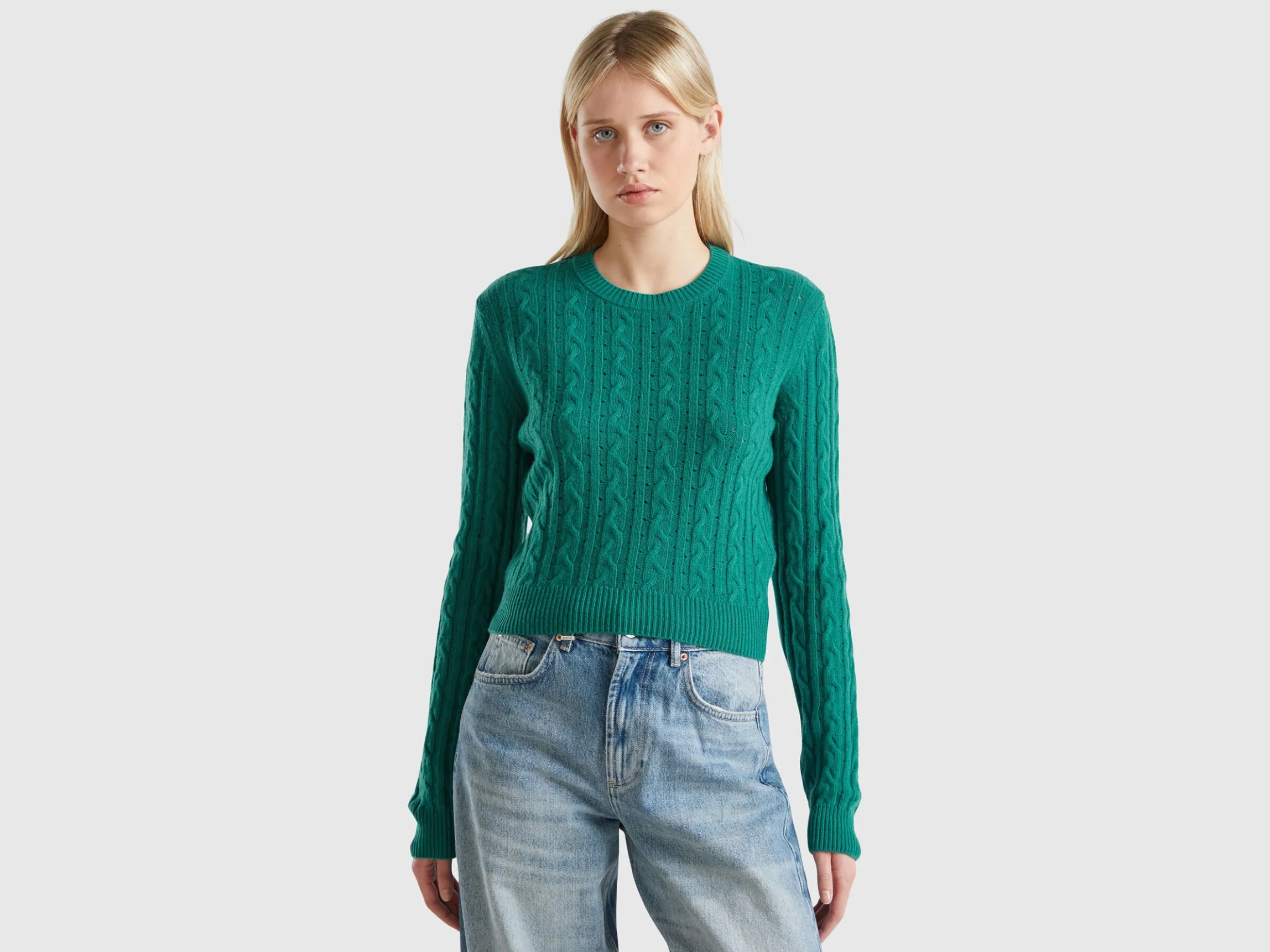 Cropped sweater with cable knit and perforations