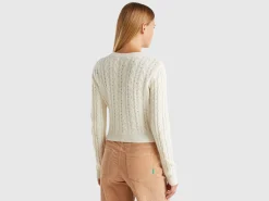Cropped sweater with cable knit and perforations