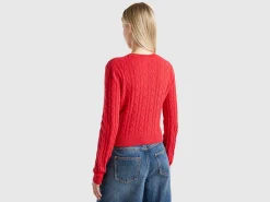 Cropped sweater with cable knit and perforations