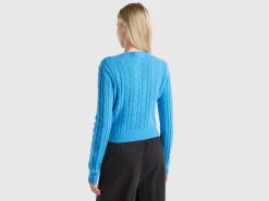 Cropped sweater with cable knit and perforations