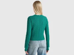 Cropped sweater with cable knit and perforations