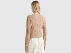 Cropped sweater with cable knit and perforations