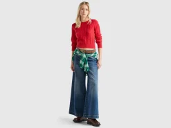 Cropped sweater with cable knit and perforations