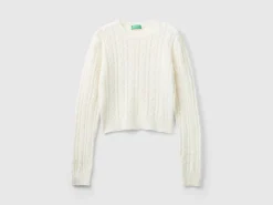Cropped sweater with cable knit and perforations