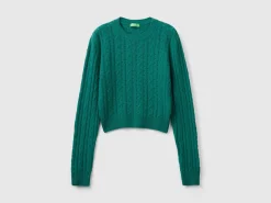 Cropped sweater with cable knit and perforations