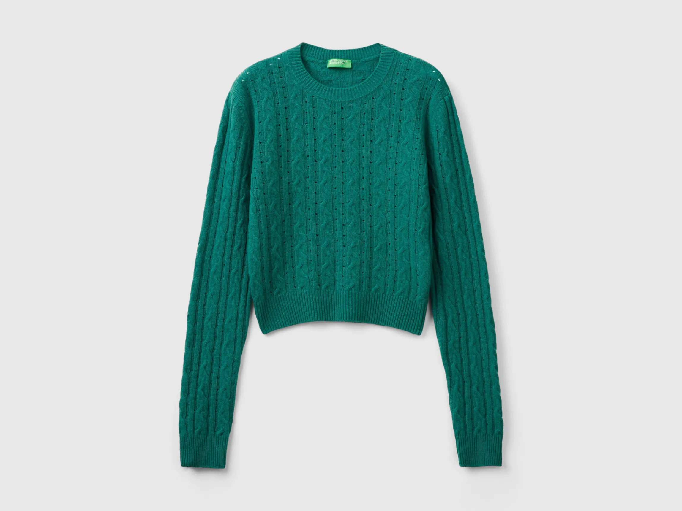 Cropped sweater with cable knit and perforations