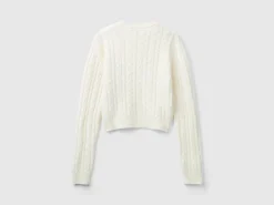 Cropped sweater with cable knit and perforations