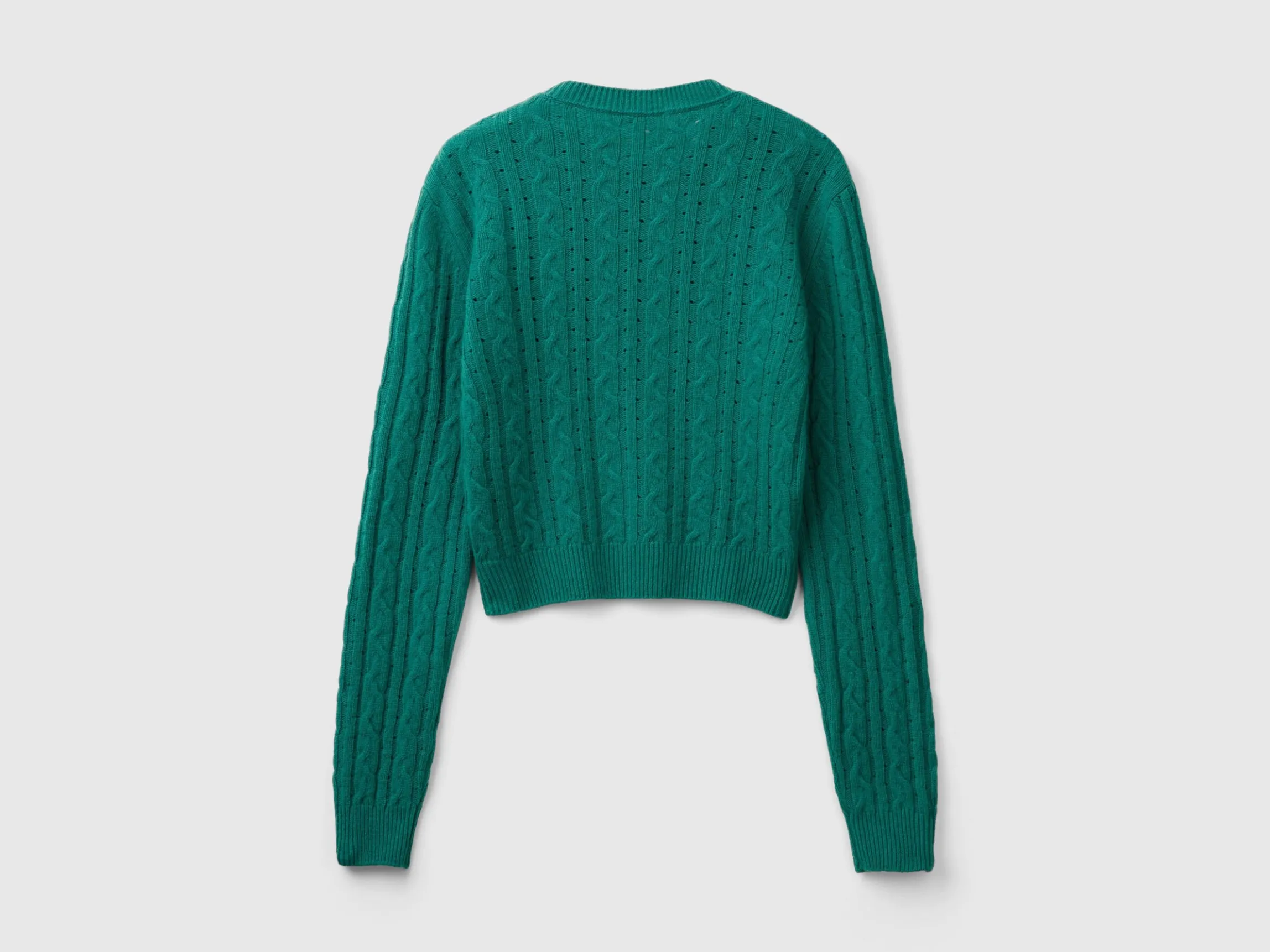 Cropped sweater with cable knit and perforations