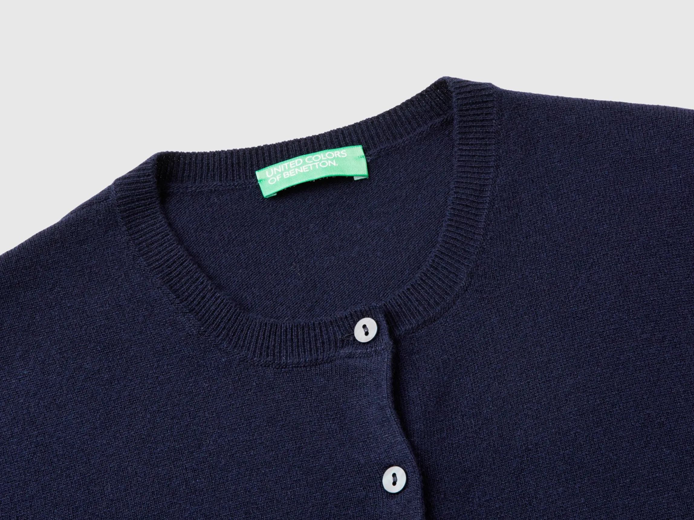 Dark blue crew neck cardigan in pure Merino wool