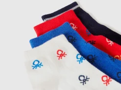 Four pairs of short socks with logos
