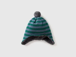 Hat with earflaps and pom pom