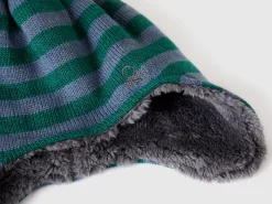 Hat with earflaps and pom pom