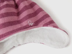 Hat with earflaps and pom pom