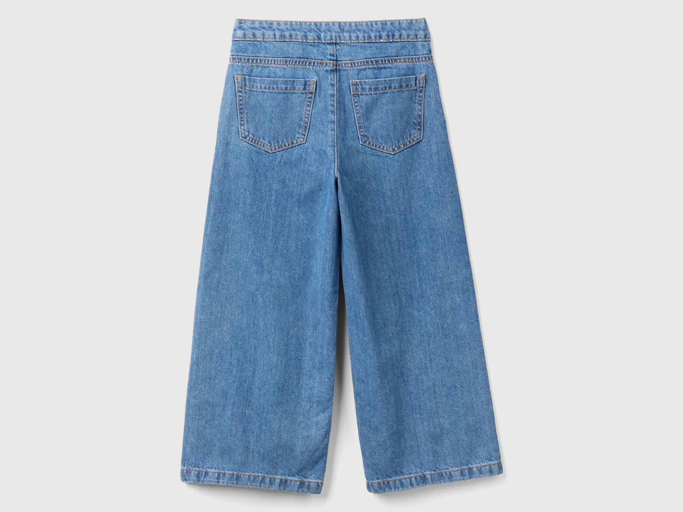 Jeans with jewel effect applique