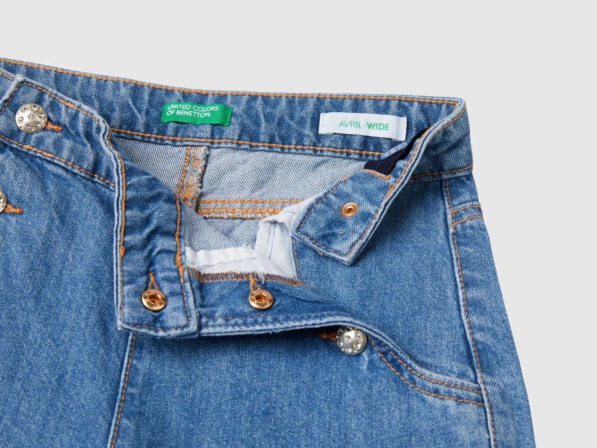 Jeans with jewel effect applique
