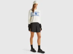 Knit sweater with inlay