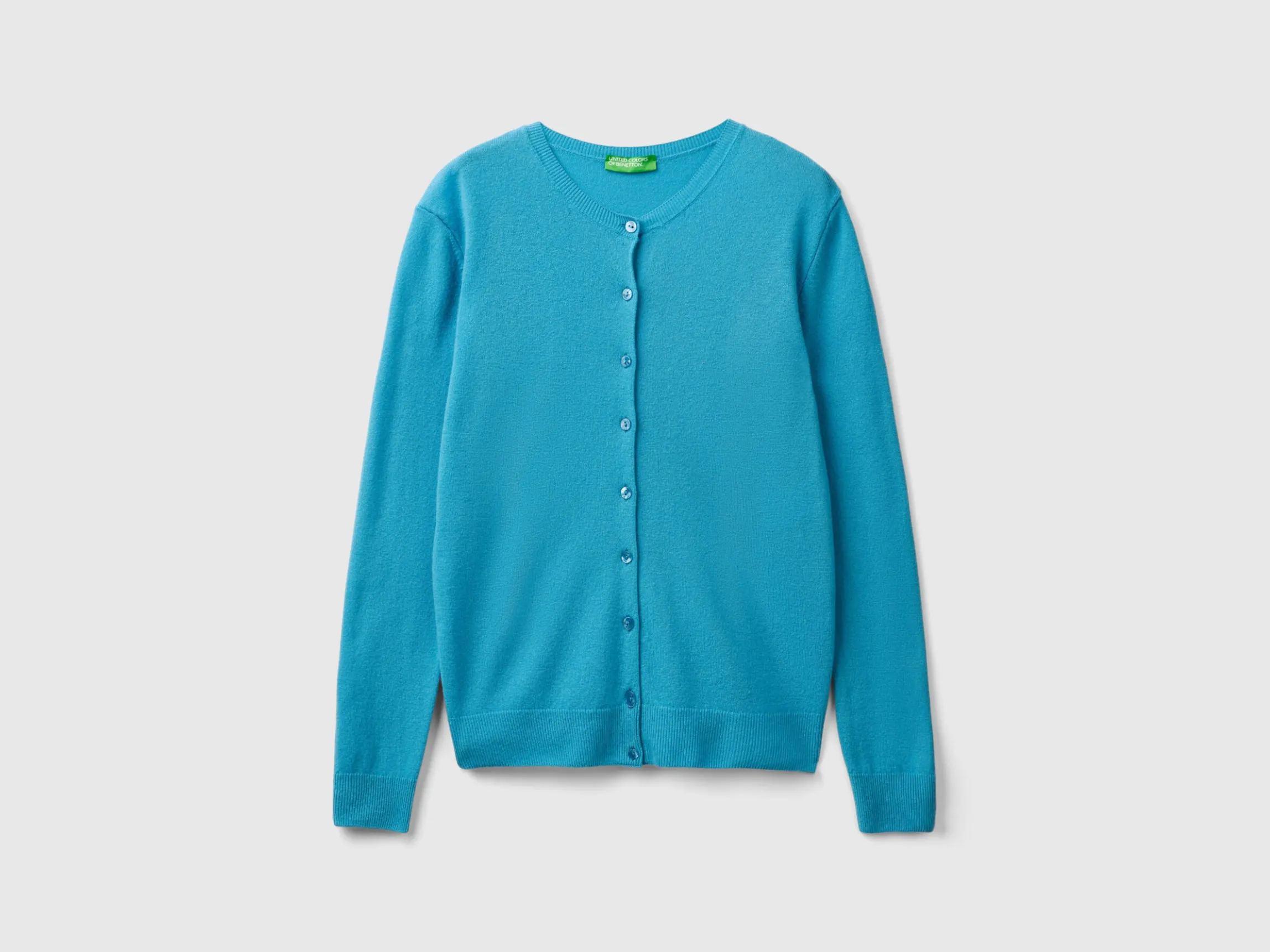 Light blue crew neck cardigan in pure Merino wool