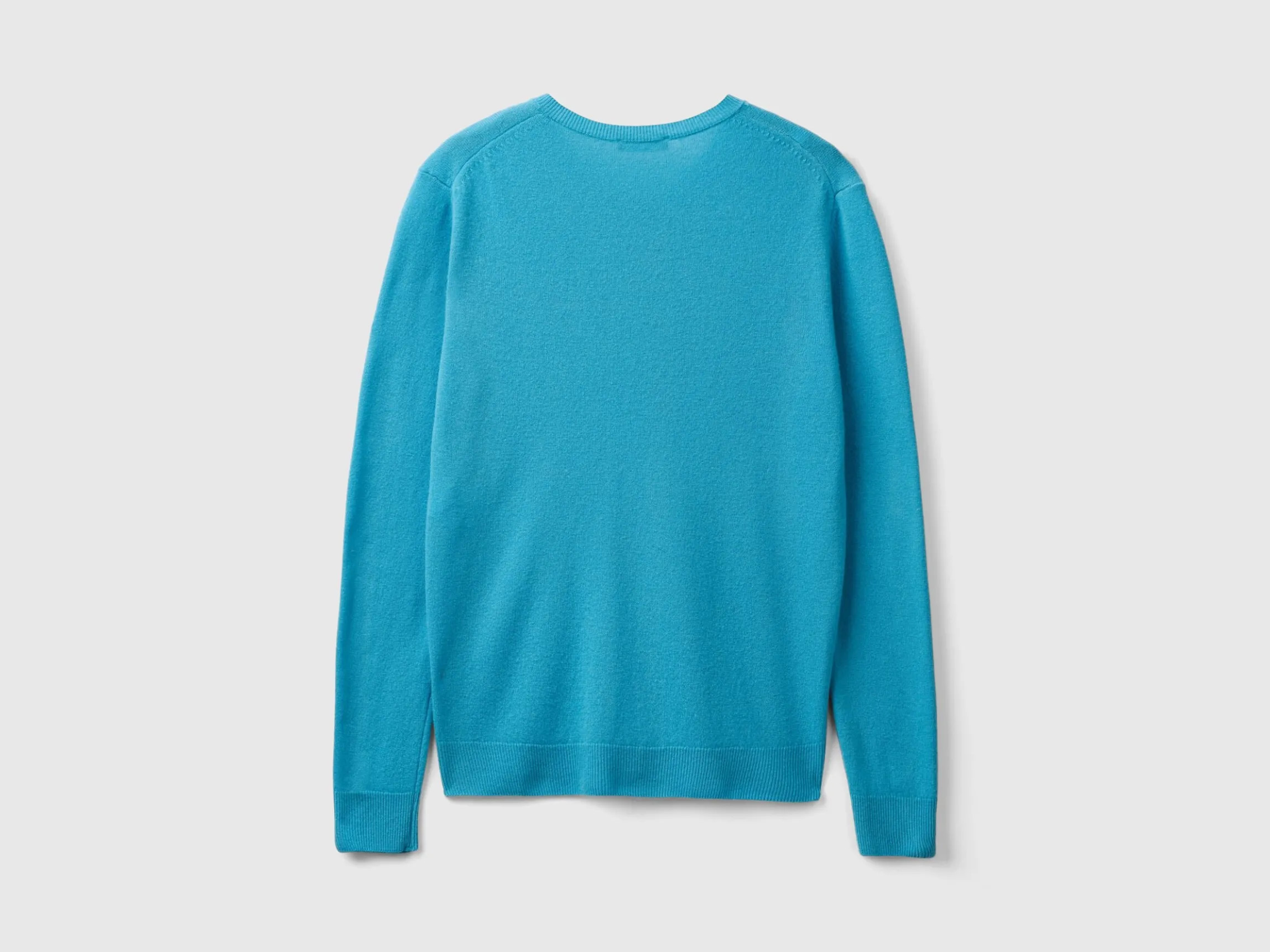 Light blue crew neck cardigan in pure Merino wool