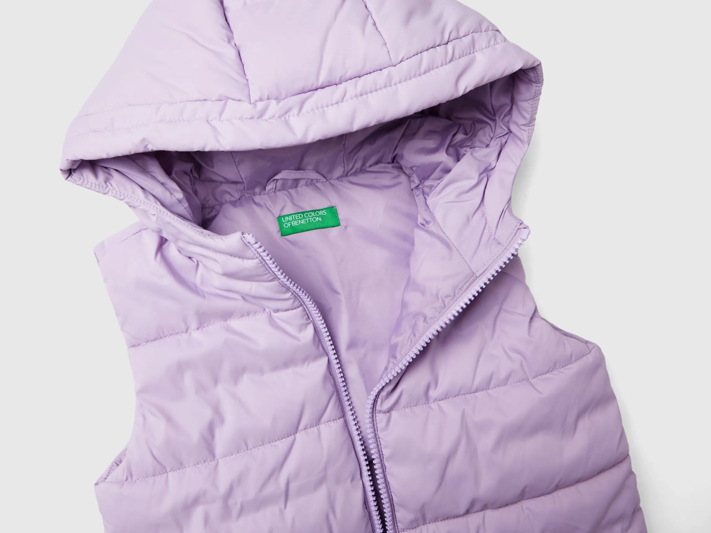 Padded vest with hood