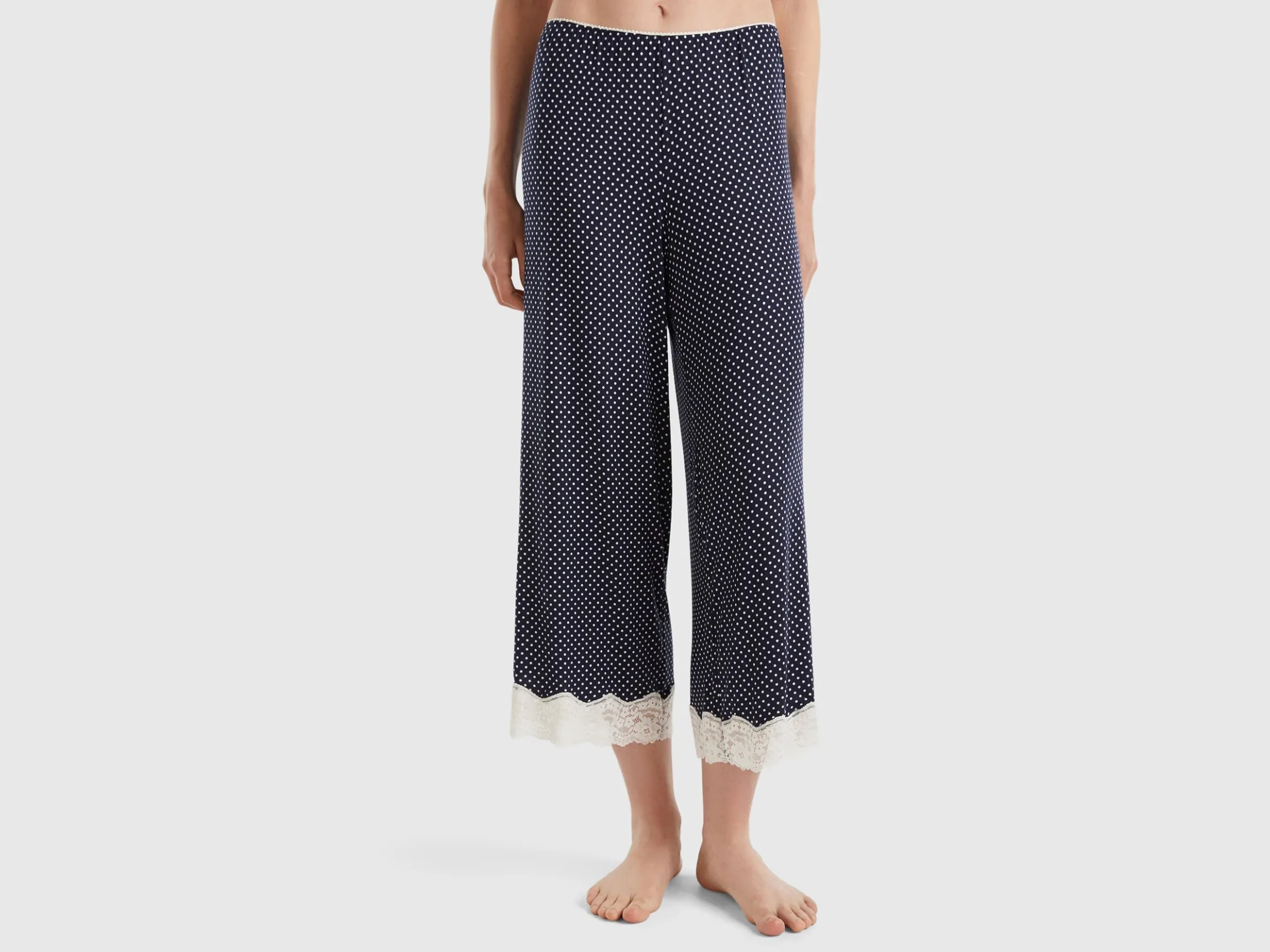 Polka dot trousers with lace details