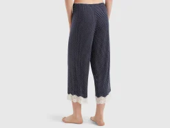 Polka dot trousers with lace details