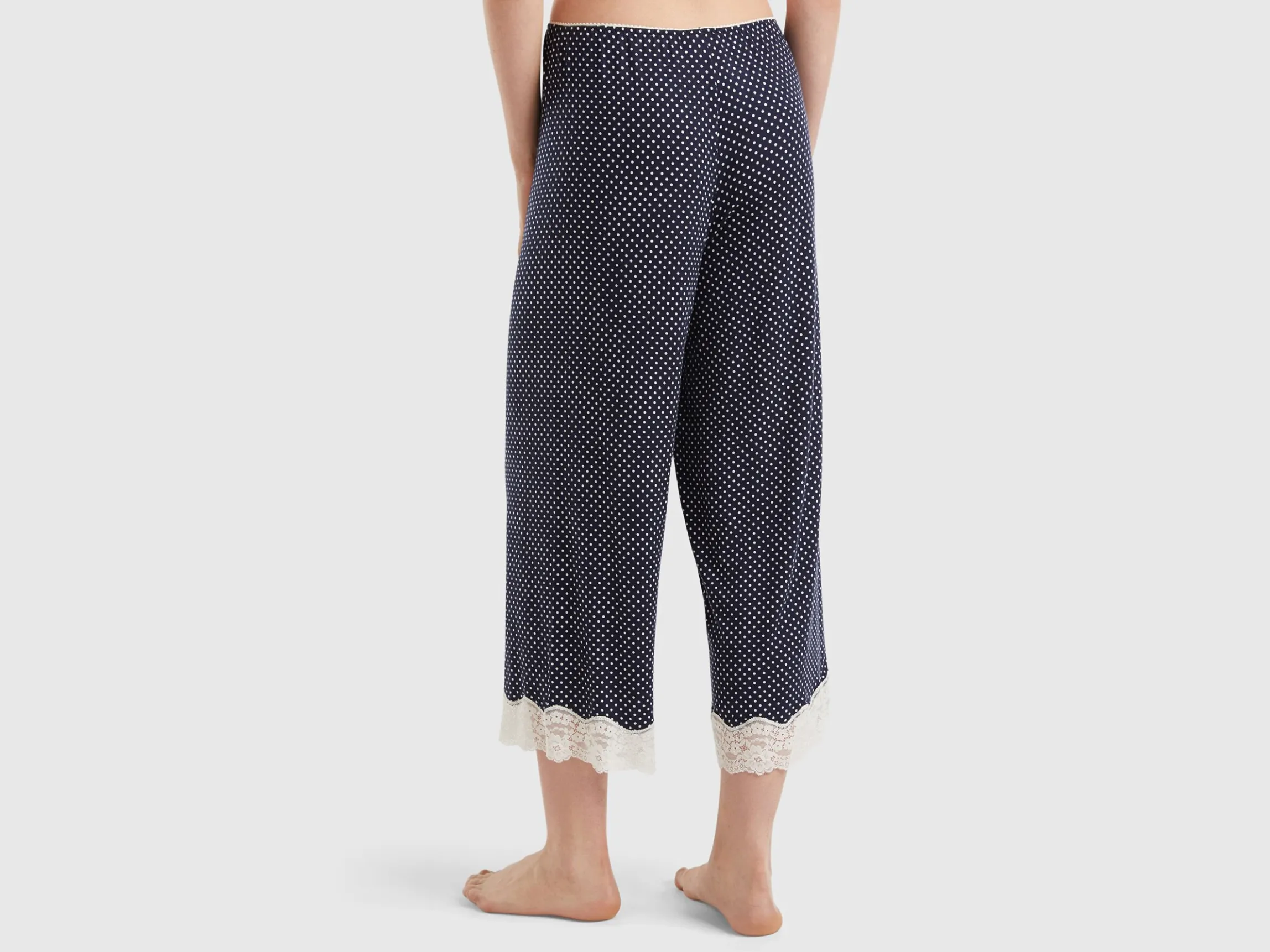 Polka dot trousers with lace details