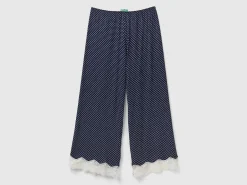 Polka dot trousers with lace details