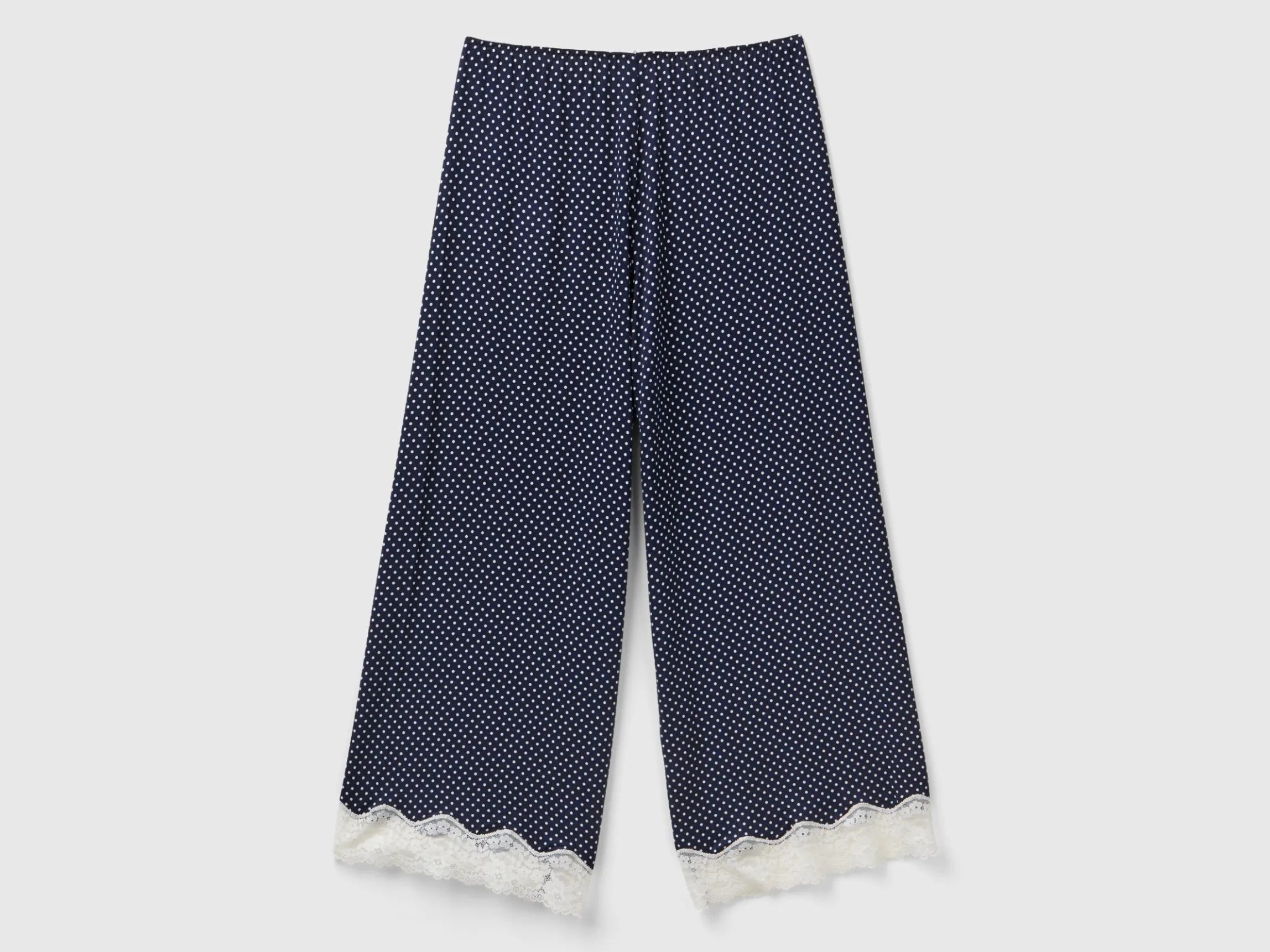 Polka dot trousers with lace details