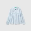 Shirt with rouches on the yoke