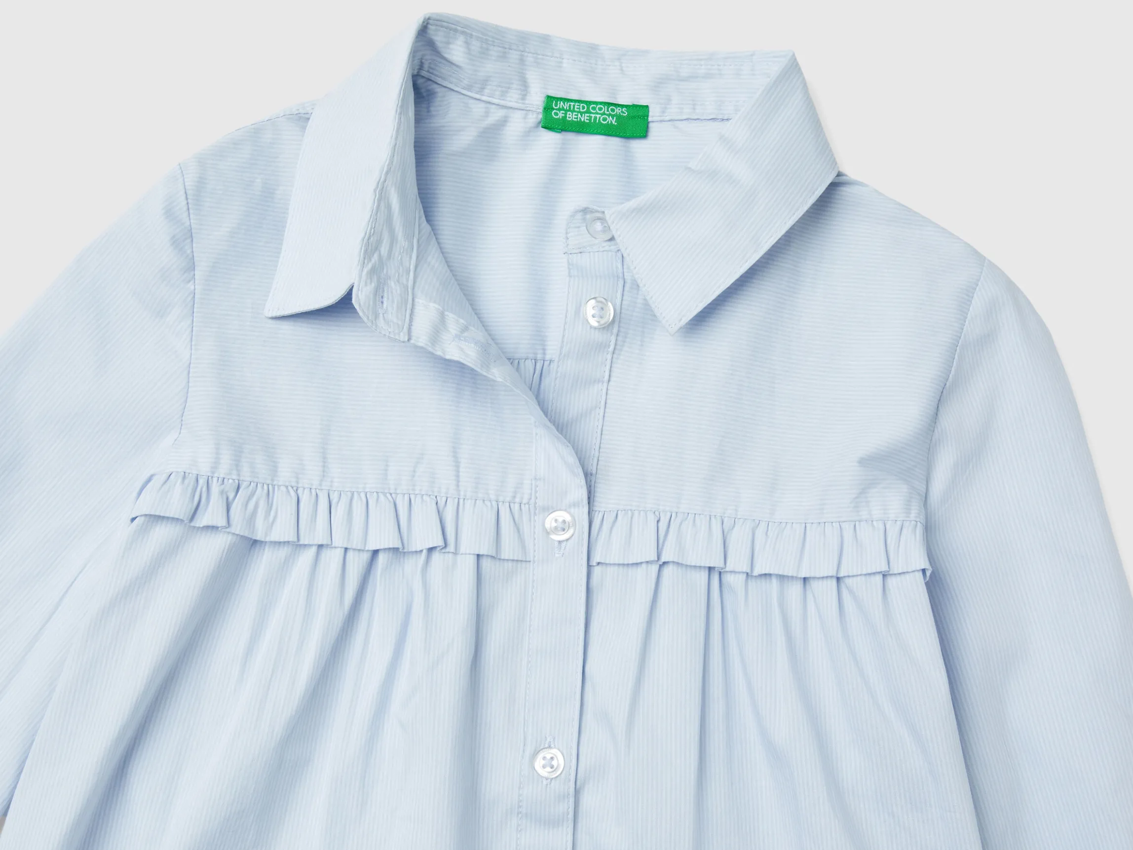 Shirt with rouches on the yoke