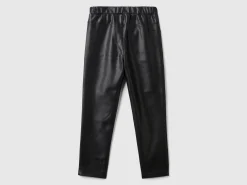 Slim fit trousers in imitation leather fabric