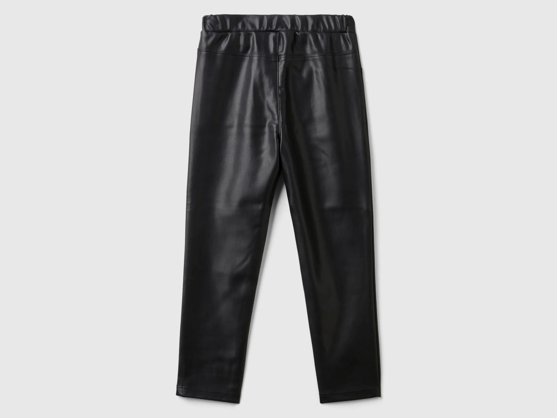 Slim fit trousers in imitation leather fabric
