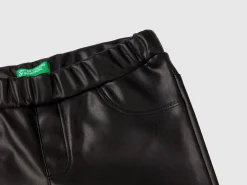 Slim fit trousers in imitation leather fabric