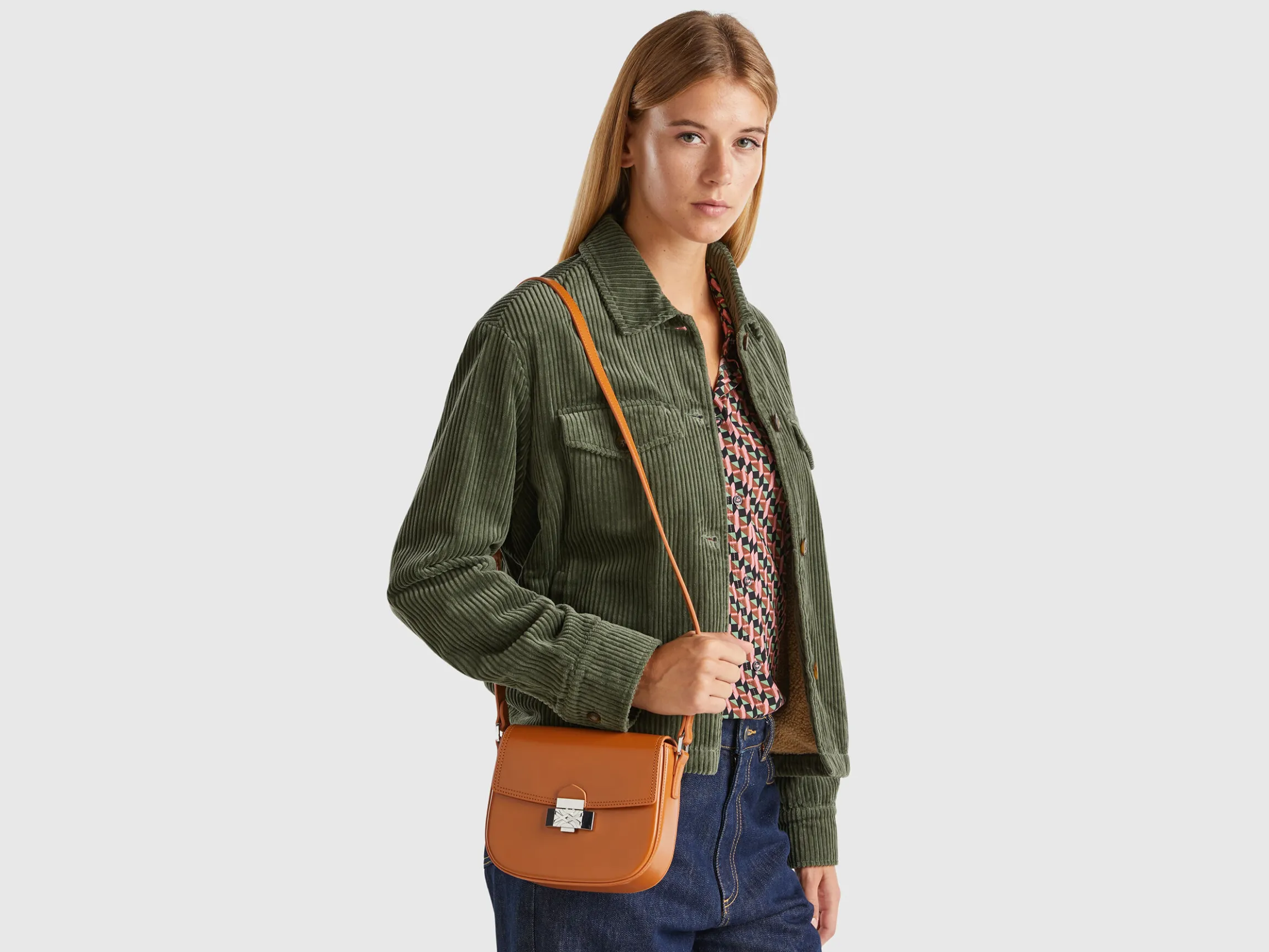 Small crossbody bag in synthetic patent leather