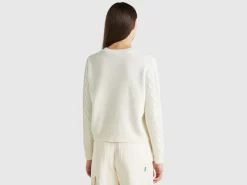 Sweater with cable knit and rhinestones