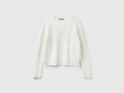 Sweater with cable knit and rhinestones