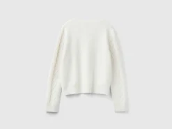 Sweater with cable knit and rhinestones