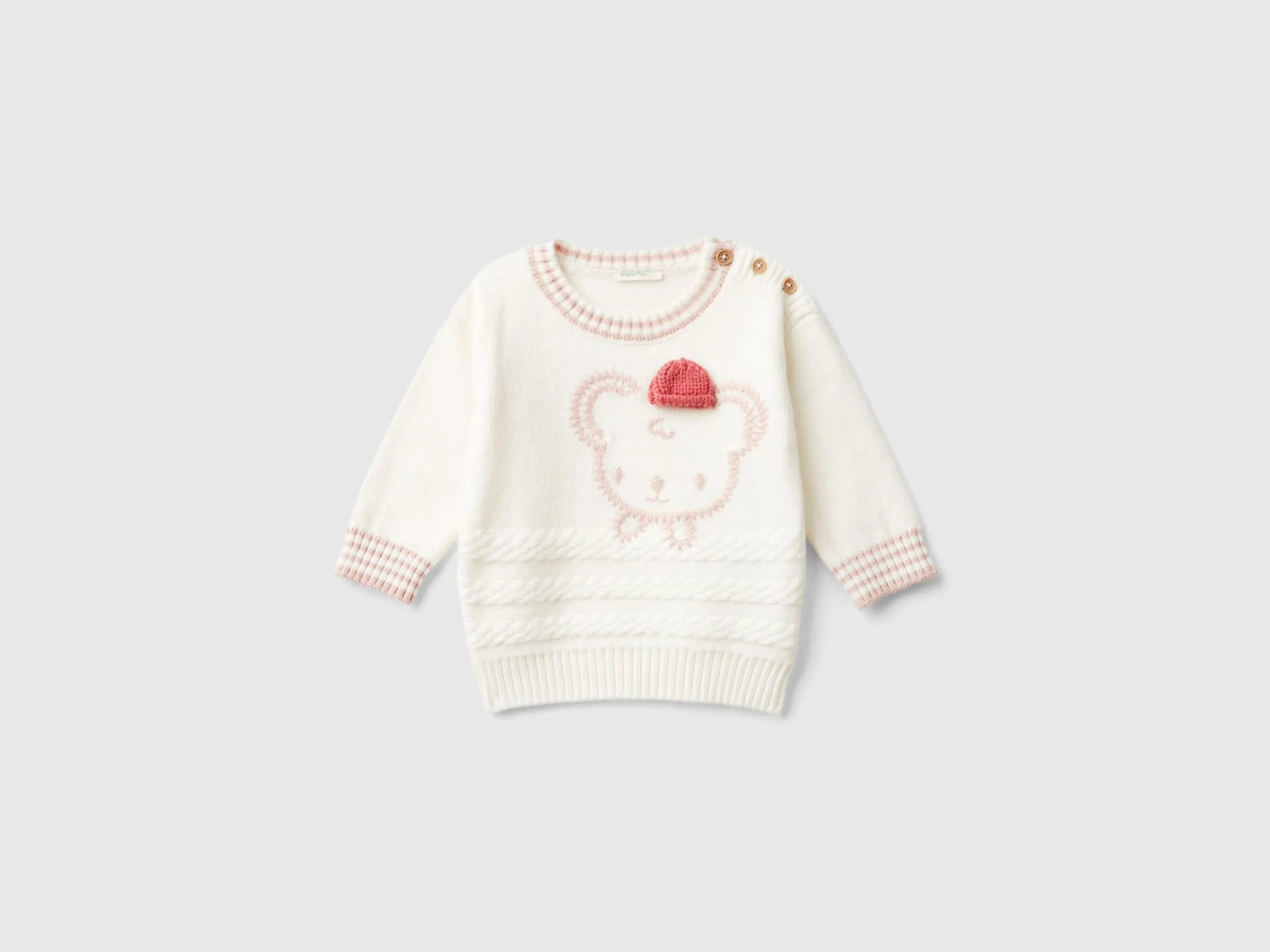 Sweater with embroidery and applique