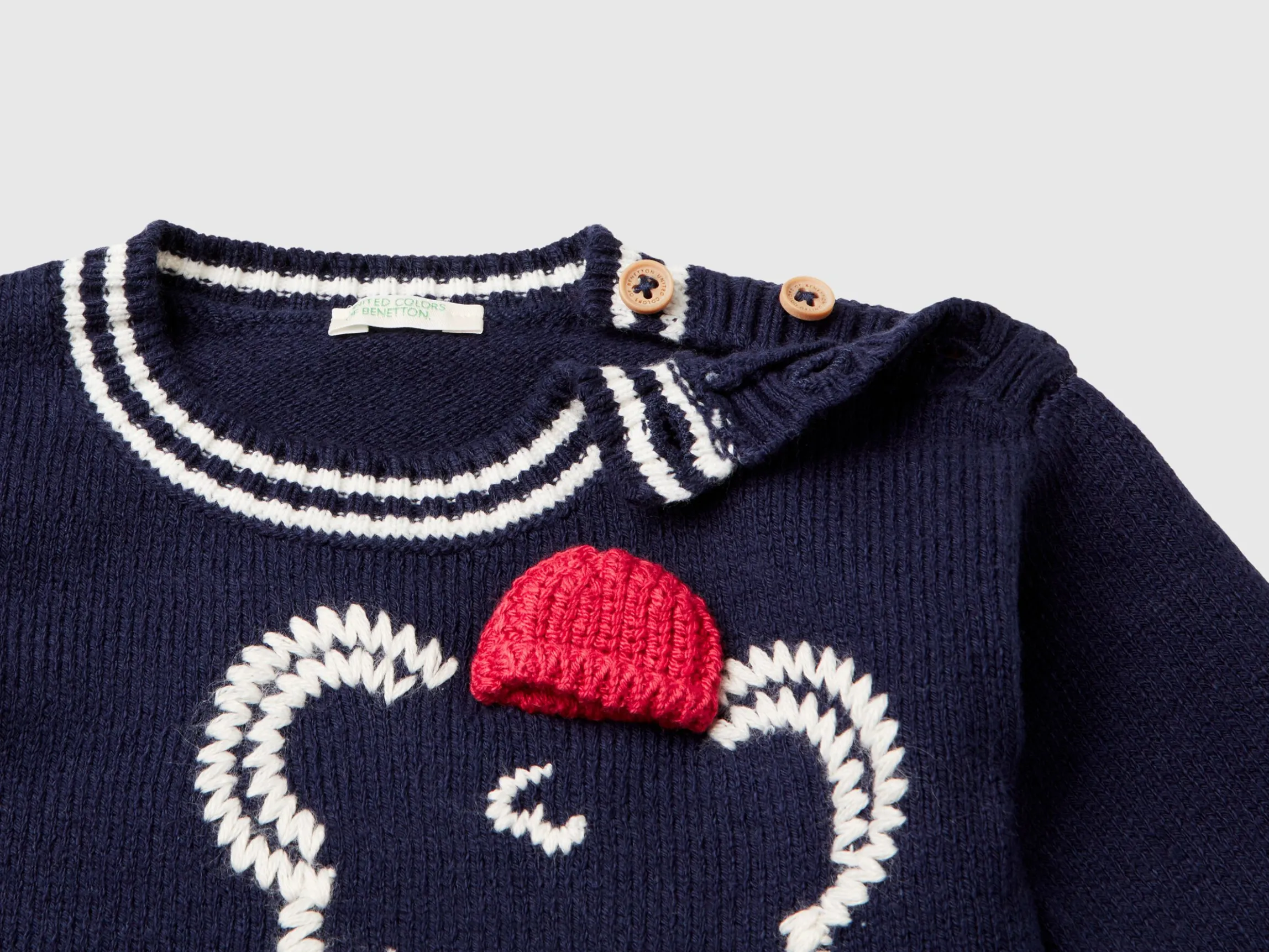 Sweater with embroidery and applique